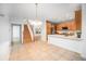 Open concept kitchen with tile floors, wooden cabinets, and stainless steel appliances at 5607 S Gray St, Littleton, CO 80123