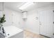 Functional laundry room with washer, dryer, storage cabinets, and tiled flooring at 5607 S Gray St, Littleton, CO 80123