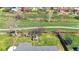 Aerial view of backyard featuring lush greenery, mature trees, trampoline and greenhouse, creating a private oasis at 5747 W Elmhurst Ave, Littleton, CO 80128