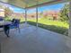 Relaxing back porch with outdoor seating and backyard views, perfect for enjoying outdoor living and entertainment at 5747 W Elmhurst Ave, Littleton, CO 80128