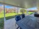 Relaxing back porch with outdoor seating and backyard views, perfect for enjoying outdoor living and entertainment at 5747 W Elmhurst Ave, Littleton, CO 80128