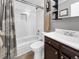 Clean bathroom featuring bathtub with shower, and vanity at 5747 W Elmhurst Ave, Littleton, CO 80128