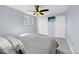 Cozy bedroom with ceiling fan, closet, and neutral decor at 5747 W Elmhurst Ave, Littleton, CO 80128