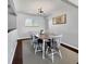 Charming dining room with an oval table, seating for six, and a stylish chandelier at 5747 W Elmhurst Ave, Littleton, CO 80128