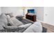 Inviting living room with plush sofa, modern media center, and elegant flooring, creating a comfortable space at 5747 W Elmhurst Ave, Littleton, CO 80128