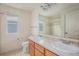 Bright bathroom featuring a shower over tub, and a double sink vanity at 11973 Song Bird Hills St, Parker, CO 80138