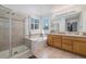 Bright bathroom with separate shower and bathtub, dual sinks, and modern fixtures at 11973 Song Bird Hills St, Parker, CO 80138