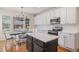 Eat-in kitchen with center island and stainless steel appliances at 11973 Song Bird Hills St, Parker, CO 80138