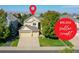 Charming two-story home with a well-manicured lawn, three car garage, and mature trees at 11973 Song Bird Hills St, Parker, CO 80138