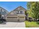 Charming two-story home with a three car garage and well-maintained lawn at 11973 Song Bird Hills St, Parker, CO 80138