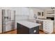 Well-equipped kitchen featuring stainless steel appliances, ample storage, and center island at 11973 Song Bird Hills St, Parker, CO 80138