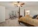 Comfortable primary bedroom featuring carpeted floor, seating area, and vaulted ceilings at 11973 Song Bird Hills St, Parker, CO 80138