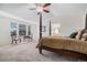 Spacious primary bedroom featuring vaulted ceilings, seating area, and ensuite bathroom access at 11973 Song Bird Hills St, Parker, CO 80138