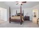 Spacious main bedroom featuring a four-poster bed and neutral decor at 11973 Song Bird Hills St, Parker, CO 80138