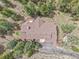 Aerial view of home featuring mature trees, a brown roof, and an outdoor deck at 3726 Spring Valley Trl, Evergreen, CO 80439