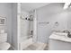 Bathroom with a tub shower, and a single sink vanity with great natural lighting at 3726 Spring Valley Trl, Evergreen, CO 80439