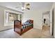 Charming bedroom features a large window with seating and carpet floors at 3726 Spring Valley Trl, Evergreen, CO 80439