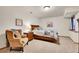 Bedroom featuring a hardwood bed frame, night stand, and neutral colored carpet flooring at 3726 Spring Valley Trl, Evergreen, CO 80439