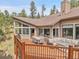View of spacious deck with outdoor seating area at 3726 Spring Valley Trl, Evergreen, CO 80439