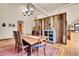 Dining room featuring a wood table, area rug, and view to an open kitchen concept at 3726 Spring Valley Trl, Evergreen, CO 80439