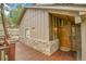The exterior features a wooden front door and stonework for added curb appeal at 3726 Spring Valley Trl, Evergreen, CO 80439