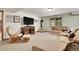 Cozy living room with a decorative fireplace and plush carpeting at 3726 Spring Valley Trl, Evergreen, CO 80439