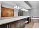 Elegant bathroom with double vanity, granite counters, soaking tub, and wood door at 3726 Spring Valley Trl, Evergreen, CO 80439