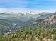 A picturesque mountain range at 3726 Spring Valley Trl, Evergreen, CO 80439