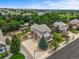 Expansive aerial view of the home surrounded by lush greenery, showcasing its prime location at 15756 E Aberdeen Ave, Centennial, CO 80016