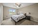 Bedroom with soft walls and carpet, with a bed and a large window at 15756 E Aberdeen Ave, Centennial, CO 80016