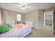 Neutral bedroom featuring soft carpet, a ceiling fan and white bedroom furniture at 15756 E Aberdeen Ave, Centennial, CO 80016