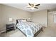 Bedroom with soft walls and carpet, with a bed and lamps on the nightstands at 15756 E Aberdeen Ave, Centennial, CO 80016