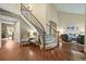 Inviting foyer with a staircase, hardwood floors, and elegant decor at 15756 E Aberdeen Ave, Centennial, CO 80016