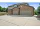 Spacious three-car garage with ample parking and a large driveway at 15756 E Aberdeen Ave, Centennial, CO 80016
