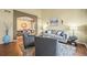 Cozy living room featuring elegant furniture, hardwood floors, and an open layout at 15756 E Aberdeen Ave, Centennial, CO 80016