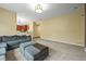 Comfortable living room layout with access to other parts of the home at 15756 E Aberdeen Ave, Centennial, CO 80016