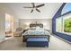 A tranquil main bedroom features a king bed, sitting area, and an ensuite bathroom at 15756 E Aberdeen Ave, Centennial, CO 80016