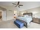 A well-appointed main bedroom leads to an ensuite bathroom with a soaking tub at 15756 E Aberdeen Ave, Centennial, CO 80016