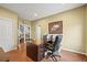 Spacious home office featuring a large desk, and natural lighting; perfect for a productive work environment at 15756 E Aberdeen Ave, Centennial, CO 80016