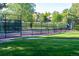 Well-maintained tennis court with surrounding fence at 2417 W 107Th Dr, Denver, CO 80234