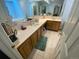 Spacious bathroom featuring dual sinks, tile countertops, and a large mirror for a bright ambiance at 7079 Estes Dr, Arvada, CO 80004