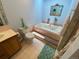 Bright bathroom with a toilet, shower, and tub for relaxation, with tile surround and floor at 7079 Estes Dr, Arvada, CO 80004