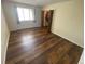 Spacious bedroom with hardwood floors, closet, and a bright window for a warm ambiance at 7079 Estes Dr, Arvada, CO 80004
