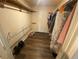 Walk-in closet with wood-look floor, shelving, and hanging racks for organized storage at 7079 Estes Dr, Arvada, CO 80004