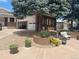 Charming brick home with an attached one-car garage and well-maintained landscaping at 7079 Estes Dr, Arvada, CO 80004