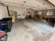 Spacious garage with ample storage space and overhead lighting at 7079 Estes Dr, Arvada, CO 80004
