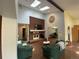 Open concept living space with brick fireplace, skylights, stained glass window, and comfortable seating at 7079 Estes Dr, Arvada, CO 80004