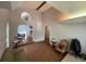 Bright living room featuring hardwood floors, high ceilings, archways, and a decorative stained glass window at 7079 Estes Dr, Arvada, CO 80004