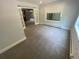 Living room with carpet and french doors leading to a bonus room or sunroom at 7079 Estes Dr, Arvada, CO 80004