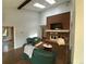 Open living room with brick fireplace, skylights, and comfortable seating at 7079 Estes Dr, Arvada, CO 80004